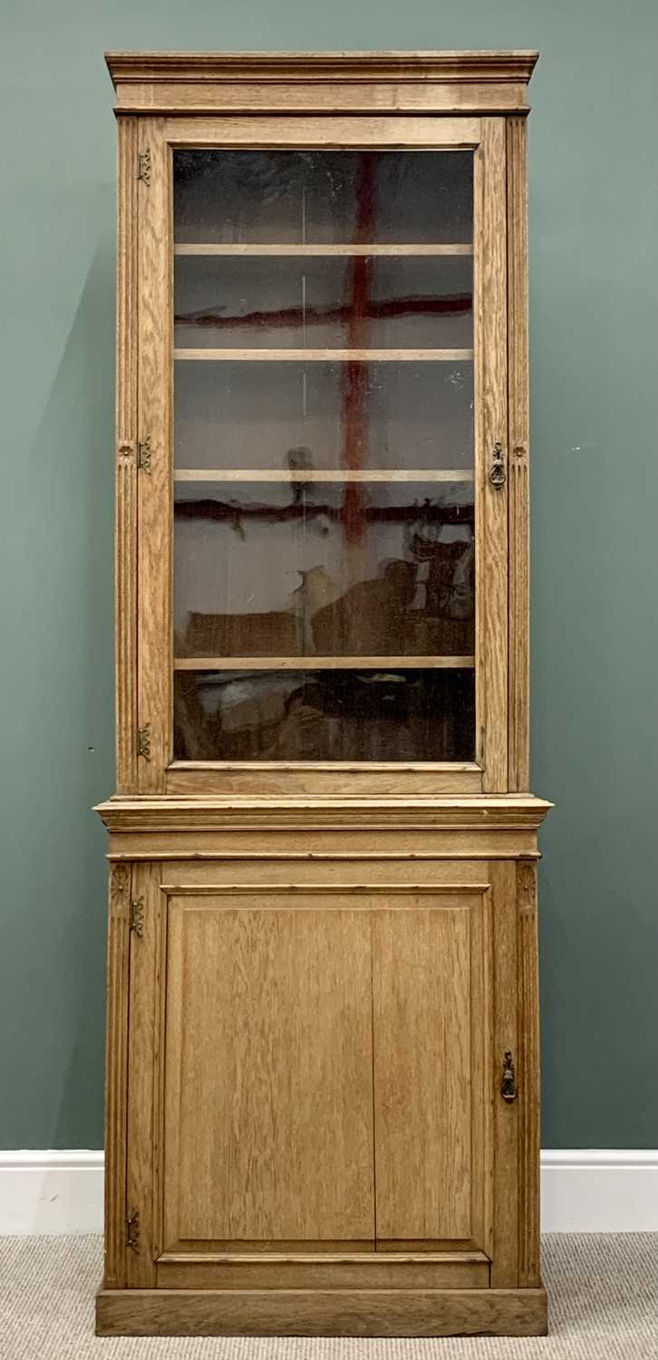 VICTORIAN OAK BOOKCASE CUPBOARD OF SLIM PROPORTIONS, having a single glazed door top with adjustable