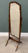 VINTAGE WALNUT CHEVAL DRESSING MIRROR, having a shaped top mirror frame and capped supports on