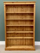 LARGE REPRODUCTION PINE BOOKCASE, with interior adjustable shelves, reeded front detail, on a plinth
