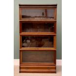 GLOBE-WERNICKE FOUR-SECTION MAHOGANY STACKING BOOKCASE, with top cover and single drawer lower base,