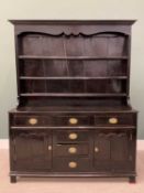 OAK AND PINE DRESSER, circa 1780 and later, having a wide boarded back to a three-shelf rack and a