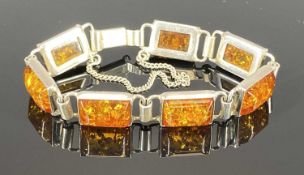 20TH CENTURY 925 SILVER & AMBER SEGMENTED BRACELET, with push clasp and safety chain, 14.5cms