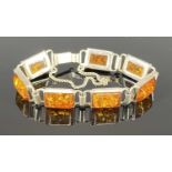 20TH CENTURY 925 SILVER & AMBER SEGMENTED BRACELET, with push clasp and safety chain, 14.5cms