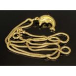 18CT GOLD LEAPING DOLPHIN PENDANT ON 9CT GOLD SNAKELINK NECKLACE, 2.5cms (including loop) the
