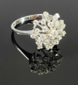 18CT WHITE GOLD TIERED STARBURST DIAMOND CLUSTER RING, having 25 individually claw set round