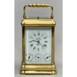 L'EPEE FRENCH GILDED BRASS CARRIAGE CLOCK, the white enamel dial signed and with subsidiary day,