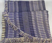 WELSH WOOLEN BLANKET, one end rounded, double-sided and fringed, geometric pattern in blues, cream