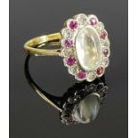 18CT YELLOW & WHITE GOLD MOONSTONE, DIAMOND & RUBY OVAL CLUSTER RING, the oval moonstone 10 x 6mm
