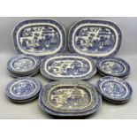 BLUE & WHITE TRANSFER DECORATED WILLOW PATTERN PLATES, A COLLECTION, including 4 x large oval meat