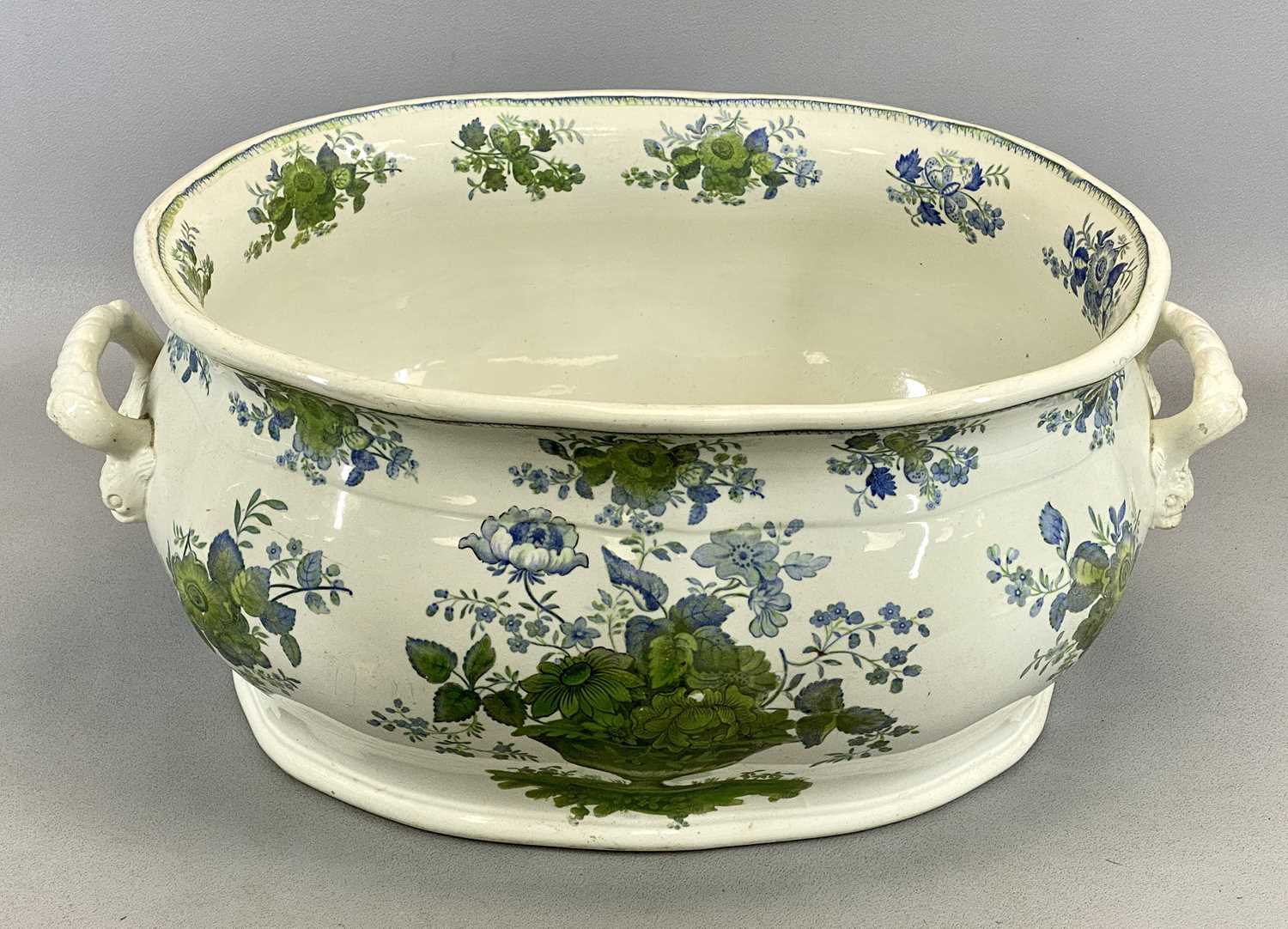 POTTERY TWO HANDLED FOOTBATH, late 19th Century, decorated in blues and greens with floral baskets - Image 2 of 4