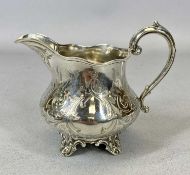 VICTORIAN SILVER CREAM JUG marks for Richard Pearce & George Burrows, 1849, having a scroll handle