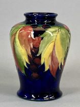 MOORCROFT VASE, of baluster form, leaf and berry pattern, signed and with impressed marks, 14cms H