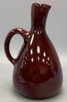 POSSIBLY DUTCH SANG DE BOEUF JUG, signed 'Zeni Oyda A9' on base, 22cms H