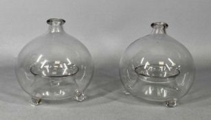 VICTORIAN BLOWN GLASS FLY CATCHERS x 2, each of circular form and standing on three feet, 16cms H (