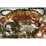 AMBER, HORN, TORTOISESHELL TYPE JEWELLERY GROUP along with white metal coin-style bracelets and a