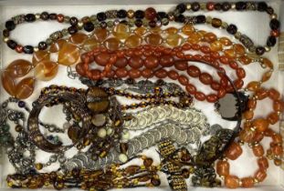 AMBER, HORN, TORTOISESHELL TYPE JEWELLERY GROUP along with white metal coin-style bracelets and a