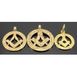 THREE 9CT GOLD MASONIC CIRCULAR PENDANTS, graduating sizes, 17mm diam. (the smallest), 19mm diam. (