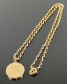 10CT GOLD CIRCULAR LOCKET ON A BELCHER LINK 9CT GOLD NECKLACE, the locket having engine turned