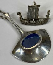 NORWEGIAN JEWELLERY IN SILVER & ENAMEL to include a stylised silver and blue enamel pendant