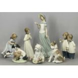 NAO PORCELAIN MODELS including figurines, 29.5cms (the tallest), and two Lladro puppies, 13cms H (