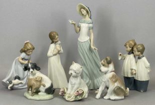 NAO PORCELAIN MODELS including figurines, 29.5cms (the tallest), and two Lladro puppies, 13cms H (