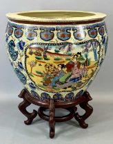 REPRODUCTION CHINESE EARTHENWARE FISH BOWL, panels decorated with figures on hardwood stand, 51cms