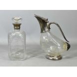 SILVER COLLARED CUT GLASS DECANTER WITH STOPPER & A NOVELTY CLARET JUG WITH PLATED MOUNTS, the