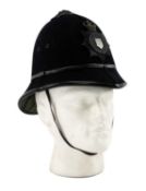 THE POLICE CLUB HOUSE: A GWYNEDD CONSTABULARY HELMET believed pre-1952, with badge, metallic rose