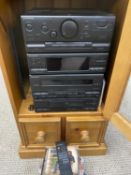PIONEER MUSIC SYSTEM WITH A SMALL QUANTITY OF CDS IN A MODERN PINE FLOORSTANDING CABINET, 86cms H,
