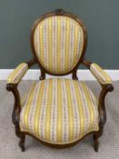 CARVED WALNUT SALON ARMCHAIR CIRCA 1880, re-upholstered in classical gold and floral stripe