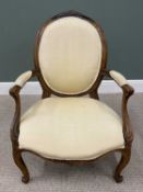 VICTORIAN CARVED WALNUT PARLOUR ARMCHAIR, re-upholstered in a neutral tone fabric, cameo shaped back