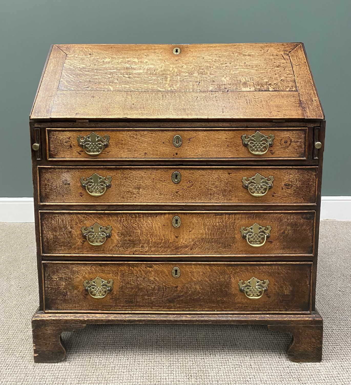 GEORGIAN OAK FALL FRONT BUREAU, the cleated end fall opening to reveal a fitted interior of