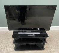 JVC SMART TV WITH REMOTE ON THREE-TIER BLACK GLASS STAND, 43-inch screen, model LT-43CF890, E/T,