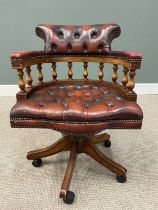 REPRODUCTION SWIVEL OFFICE / CAPTAIN'S CHAIR IN BUTTONED RED LEATHER UPHOLSTERY, with central curved