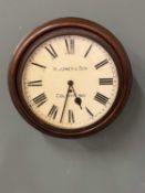 W JONES & SON, COLWYN BAY FUSEE WALL CLOCK, the dial set with Roman numerals, winding keys included,