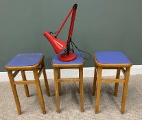 THREE MID CENTURY FABRIC SEATED STOOLS & A RED ANGLEPOISE LAMP, 61cms H, 32 x 32cms seats (the