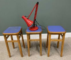 THREE MID CENTURY FABRIC SEATED STOOLS & A RED ANGLEPOISE LAMP, 61cms H, 32 x 32cms seats (the