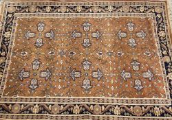 TWO EASTERN STYLE WOOLLEN RUGS, the first being hand knotted with central repeat pattern motif on
