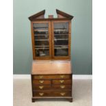 GEORGIAN PERIOD OAK BUREAU BOOKCASEcirca 1800, having a broken architectural pediment over twin