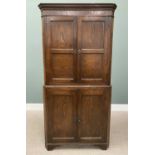 ANTIQUE OAK TWO-PIECE FLOORSTANDING CORNER CUPBOARD, having twin two-panel upper doors with interior