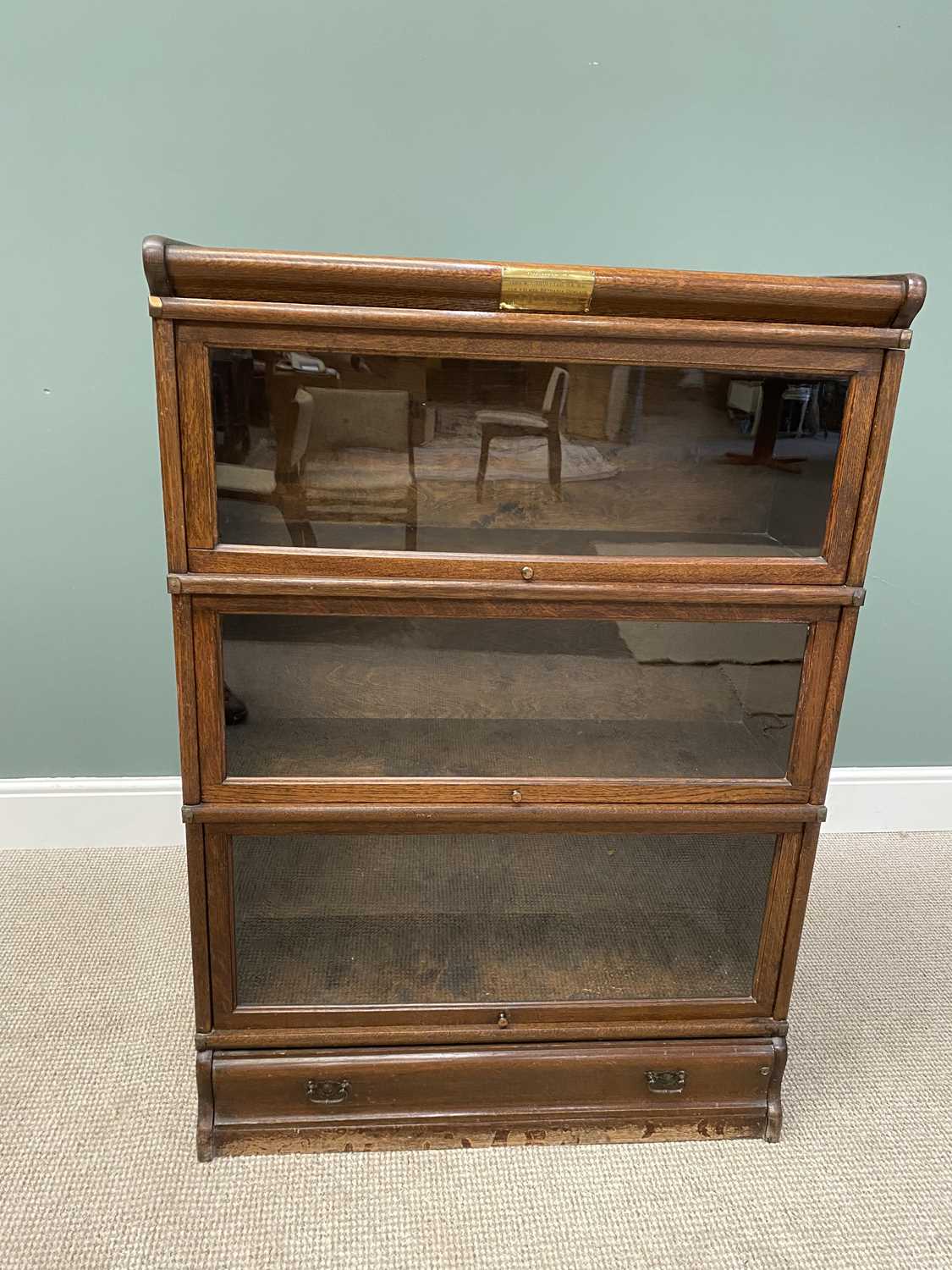 OAK -PROBABLY GLOBE WERNICKE-THREE-SECTION STACKING BOOKCASE, with top cover and single drawer base,