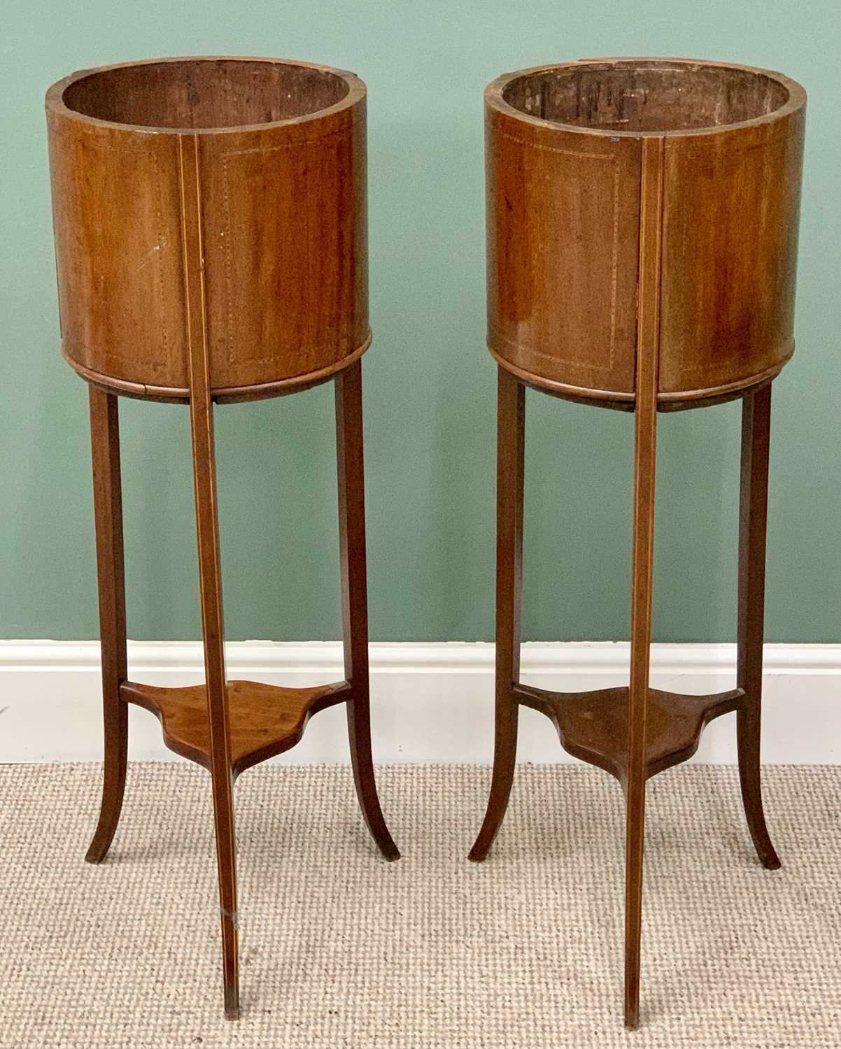 A PAIR OF MAHOGANY CIRCULAR JARDINIERE STANDS circa 1900 having boxwood stringing, on three