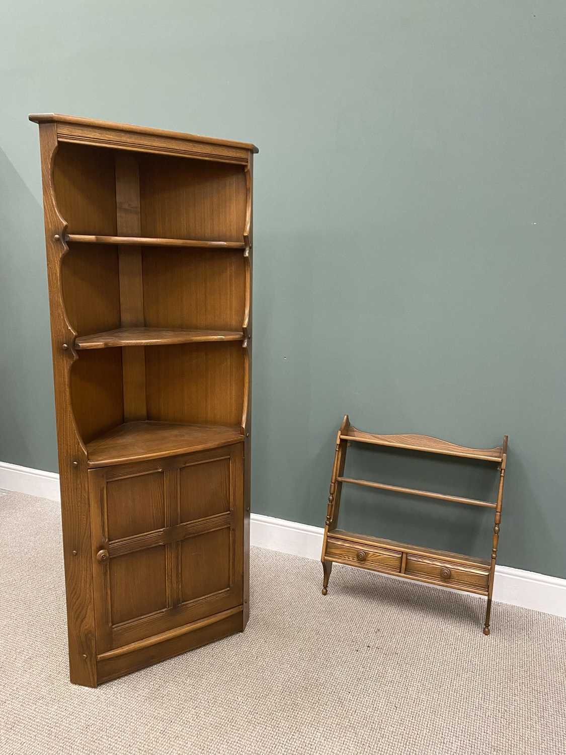 TWO ITEMS OF ERCOL LOUNGE FURNITURE comprising a floor standing corner cabinet having open upper