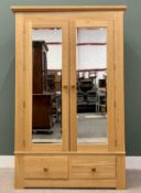 MODERN OAK DOUBLE WARDROBE, having twin upper bevelled edge mirrored doors over two lower drawers,