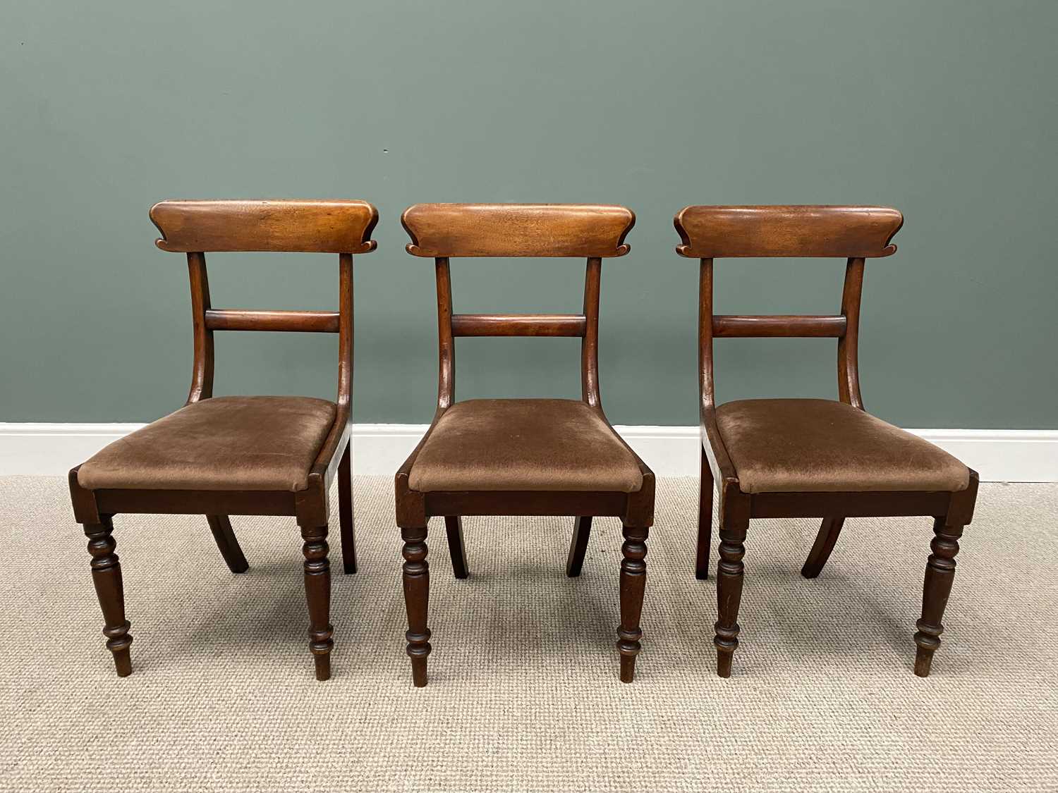 THREE VICTORIAN MAHOGANY CURVED BACK OCCASIONAL CHAIRS with upholstered drop in seat pads on