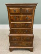 NEATLY PROPORTIONED REPRODUCTION WALNUT CHEST ON CHEST having canted upper corners flanking two