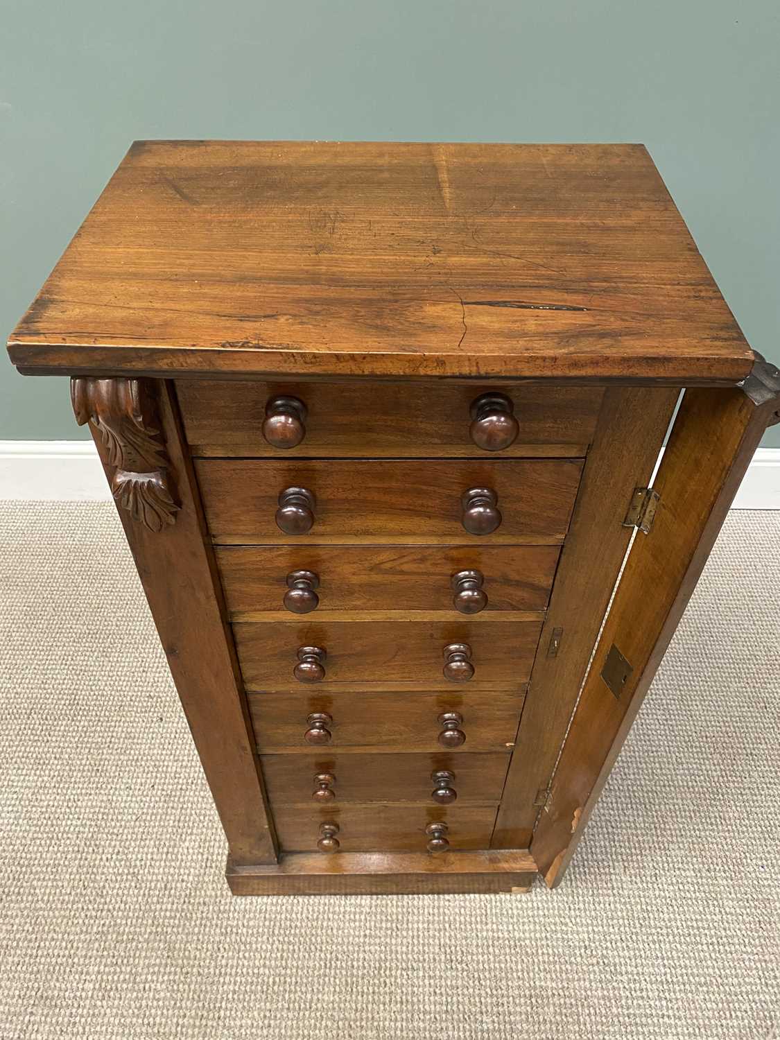 VICTORIAN MAHOGANY WELLINGTON CHEST OF SEVEN OPENING DRAWERS, with carved corbel upper detail on a - Image 2 of 2