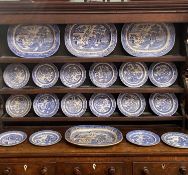 BLUE & WHITE WILLOW PATTERN POTTERY DRESSER SET, comprising 4 x 45cms across meat platters and 16