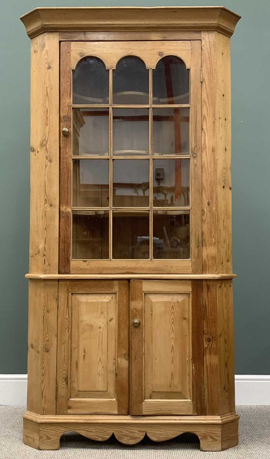 ANTIQUE STRIPPED PINE FLOOR STANDING CORNER CUPBOARD, single twelve-pane upper glazed door having