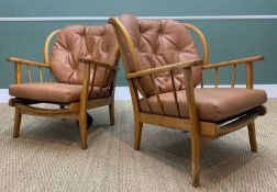 TWO MID-CENTURY ERCOL STYLE WINDSOR EASY ARMCHAIRS, tan faux leather upholstery, Pirelli rubber